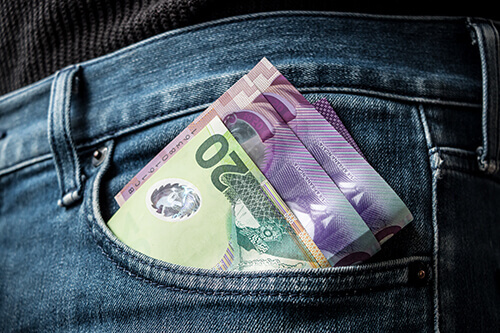 New Zealand money in pocket