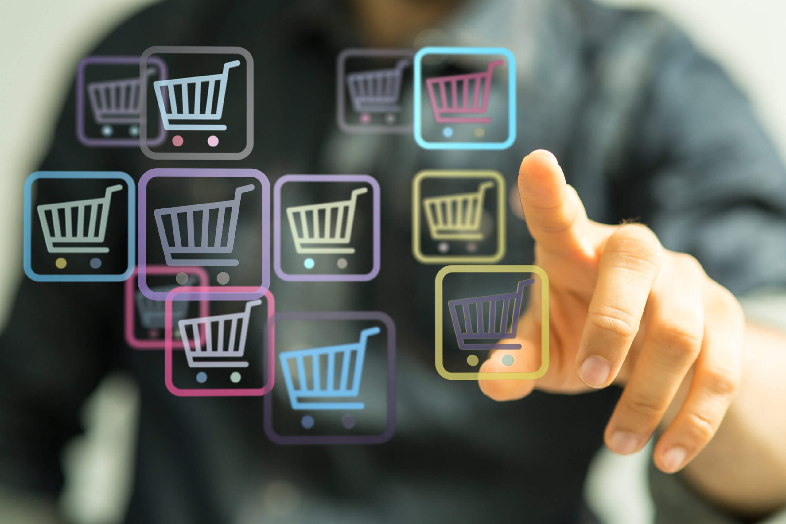 man selecting shopping car on screen