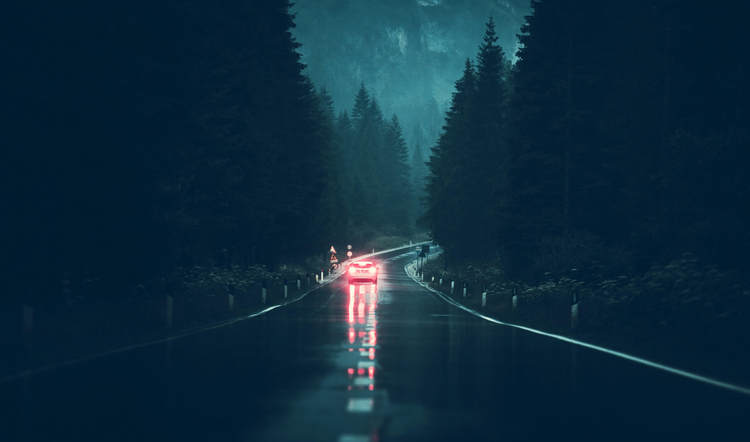 driving on wet country road at night