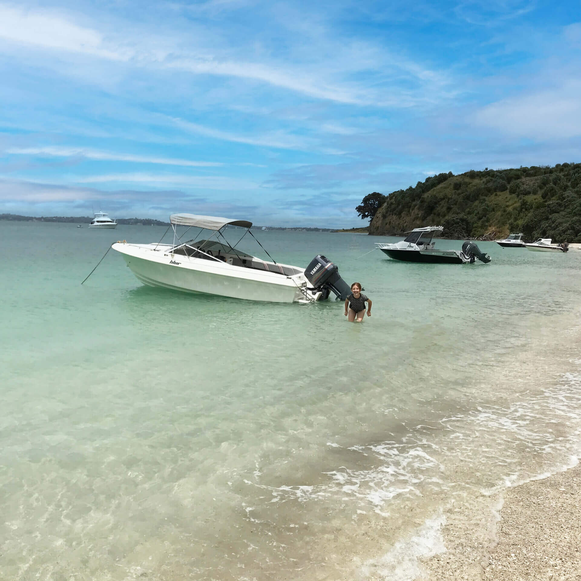 boat anchored at beach in summer