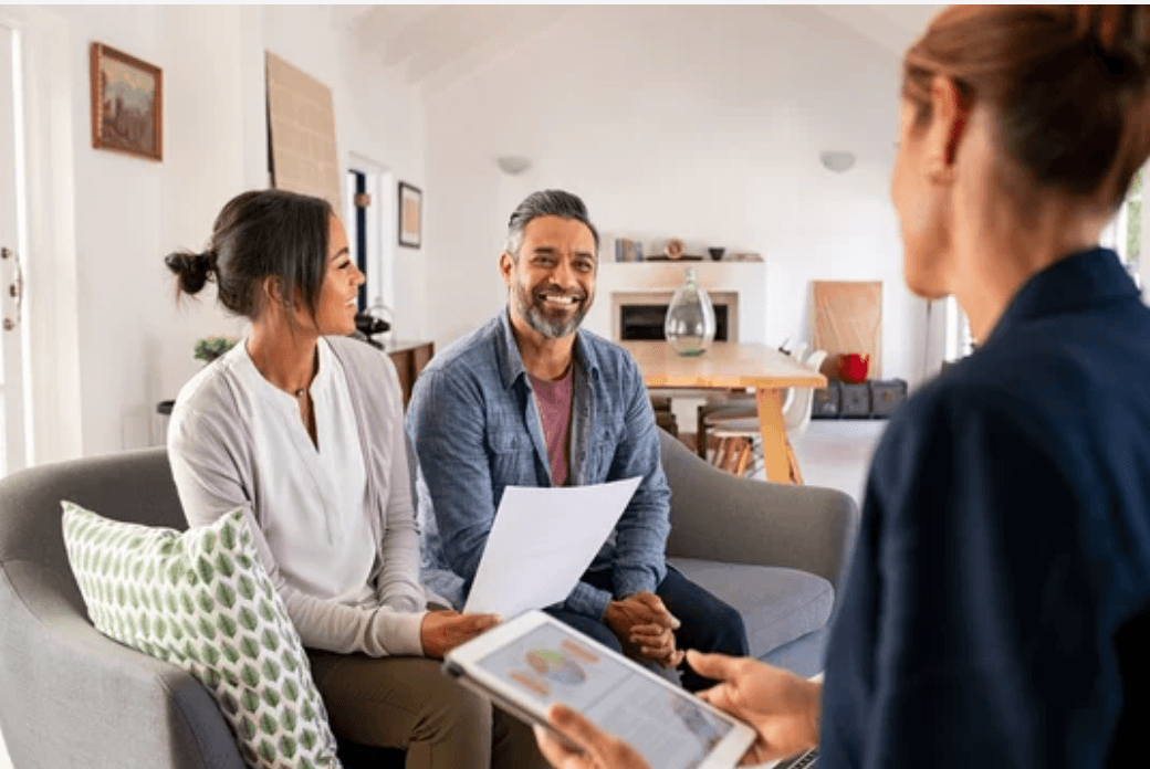 couple talking to their financial advisor