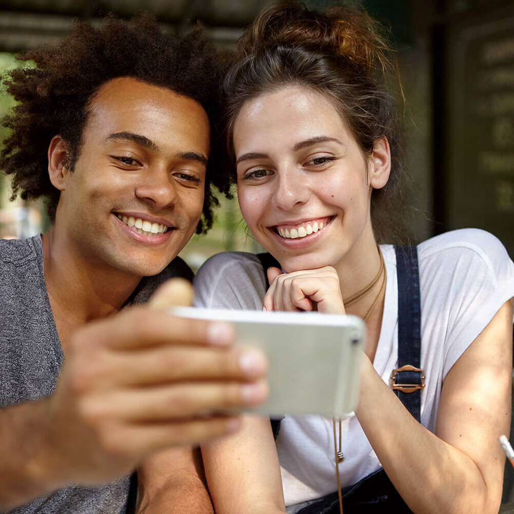 Young couple looking at phone