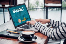 typing on laptop about budget planning