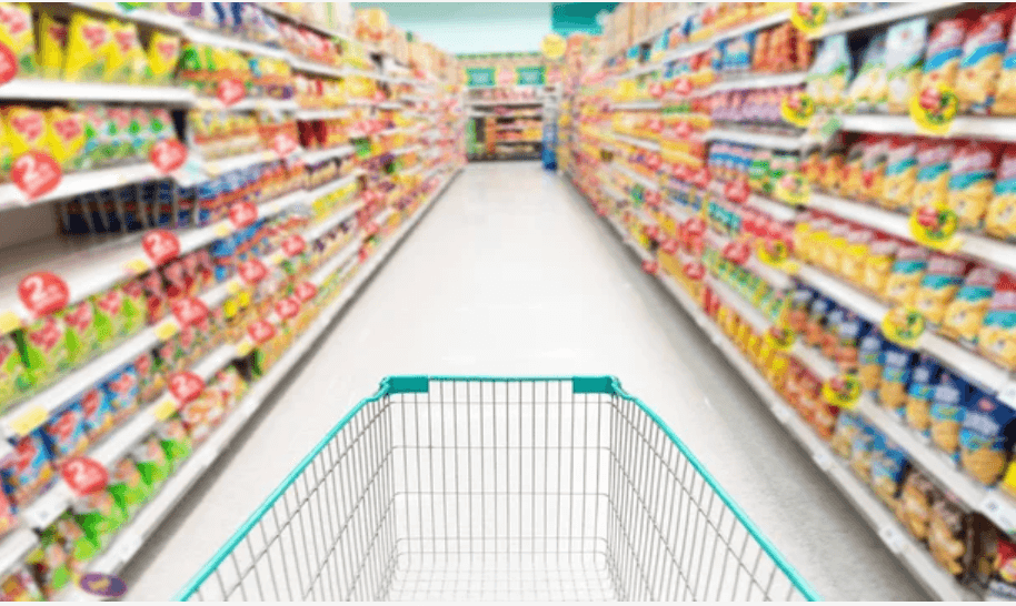 empty trolley in supermarket isle