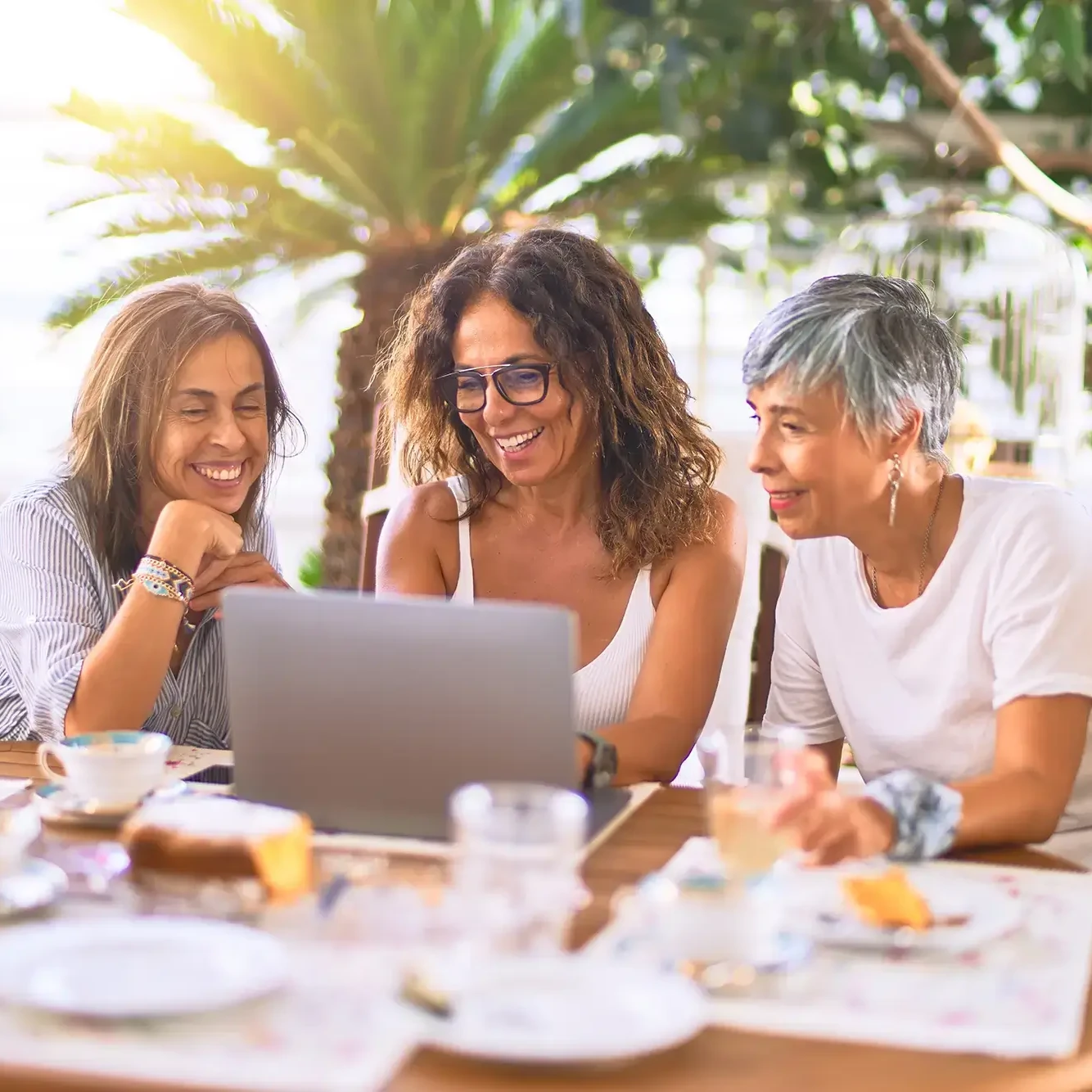 friends looking at laptop